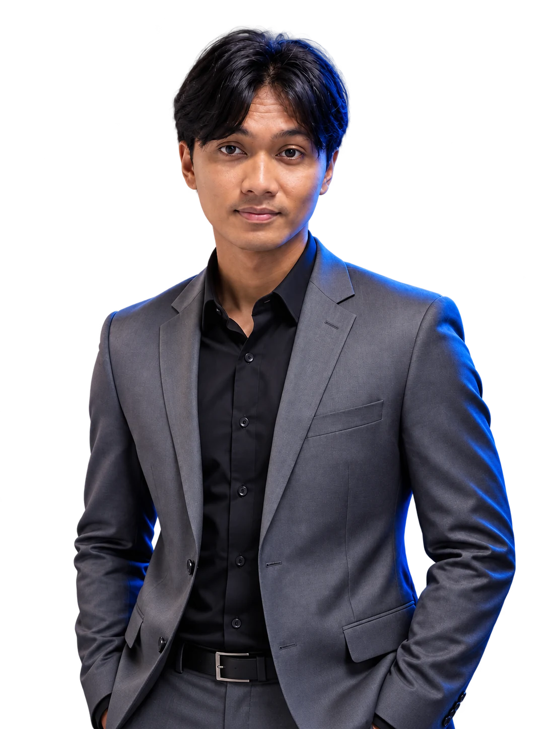 Studio portrait of Yoga Samudra Heriyanto in a grey suit with blue edge lighting and a softly lit face